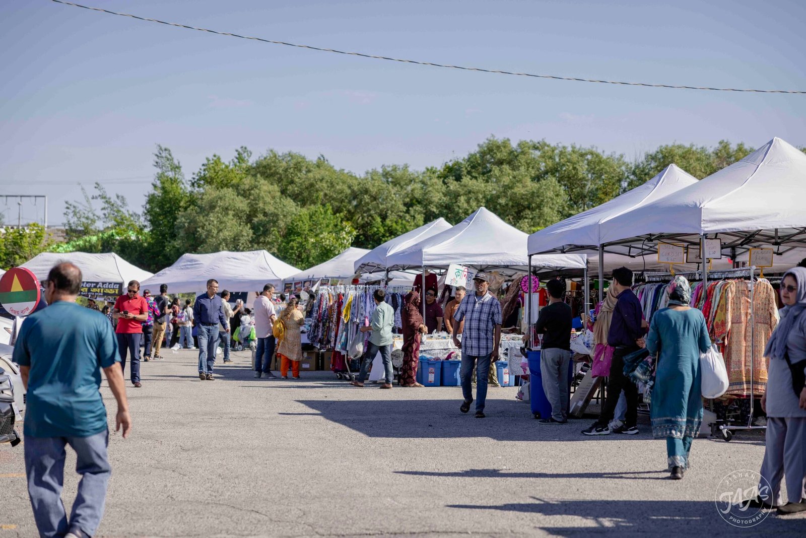 Festival vendors and visitors at a community event